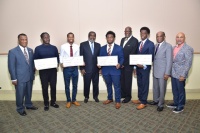 Pictured: Members of the South Florida Alpha Rho Boule awarding scholarships to students at Florida Memorial University.