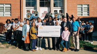 The historic Shaw University’s Platinum Sound Marching Band receives a surprise $100,000 contribution from McDonald's USA and its local Owner/Operators to fund new equipment, uniforms and essentials.