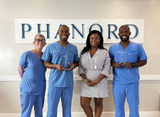 Left to right: Joanne Gordon, Office Manager at Phanord & Associates, P.A.  Dr. Kyle Phanord, Nadia Alcide, Executive Director of the Haitian American Chamber of Commerce of Florida (HACCOF) and Dr. Kevin Phanord.