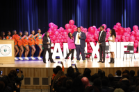 Omar Goff, president of Mielle Organics, hugs Brandi Tatum-Fedrick, head coach of the FAMU Cheerleaders, as SBI Dean Shawnta Friday-Stroud and Cheerleaders celebrate new partnership. (Credit: Ernest Nelfrard)