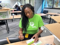 On Feb. 7, 2024, Florida Power & Light Company (FPL) volunteer Traybya Miller, lead change management consultant, packed 1,200 hygiene kits to be distributed to Broward Partnership, the largest comprehensive homeless services provider in Broward County.