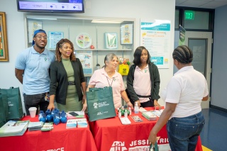 JTCHS community outreach staff members engage with fair attendees, sharing essential health and wellness information at the Men’s Health & Wellness Fair. Photo Credit: Ricardo Reyes, Sonshine Communications