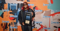 Leon Thomas (writer, "Snooze") with his Song of the Year award