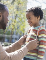 Father and daughter getting ready for school