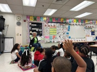 FPL Director of External Affairs for the Broward and Southwest Region Juliet Roulhac reads a book to students at Watkins Elementary