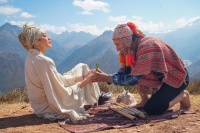 In the Sacred Valley, a Quechua shaman performs a coca leaf ritual atop the Andes, continuing a centuries-old practice central to Indigenous community care. ©️ Regina Lynch-Hudson