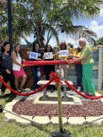FPL employees attend a ribbon-cutting ceremony to celebrate the unveiling of a new outdoor space at the Pace Center for Girls Broward.